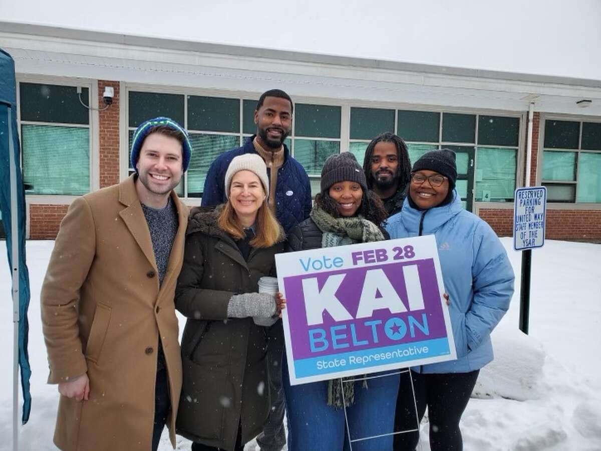 Front row, from left, Middletown Democratic Town Committee Chairman Mike Fallon, Lt. Gov. Susan Bysiewicz and 100th House District representative-elect Kai Belton pose for a photo Tuesday with Belton's family outside a polling station.