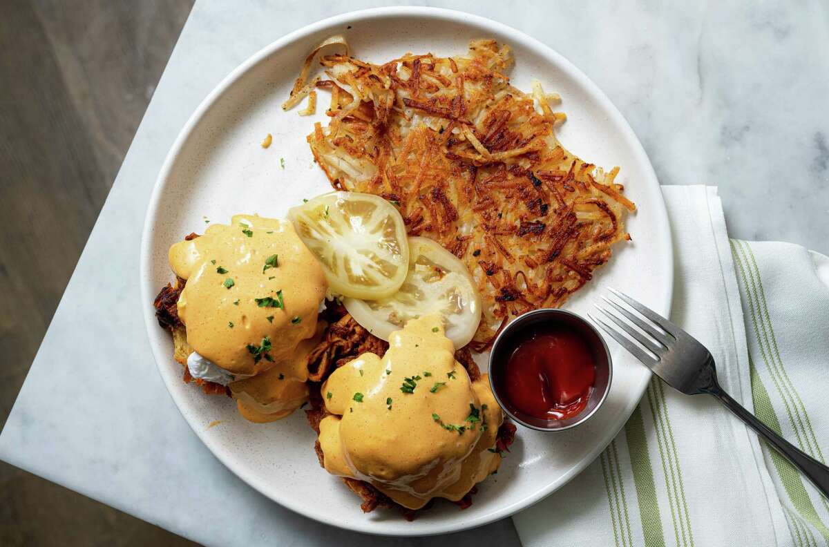Biscuit Benedict with pulled pork and smoked paprika hollandaise at Eloise Nichols restaurant, 2400 Mid Lane in River Oaks.