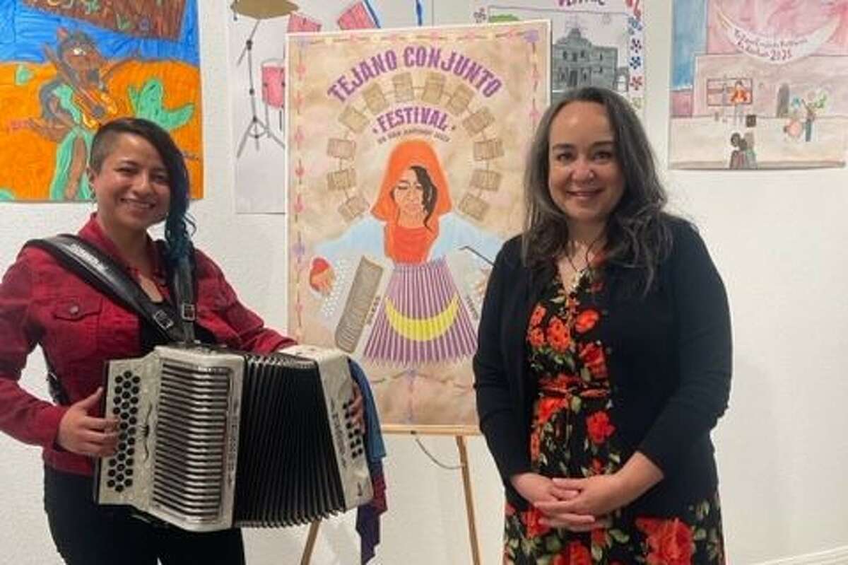 Elisa de Hoyos, designer of the winning poster, with Cristina Balli, Guadalupe Cultural Arts Center's executive director.