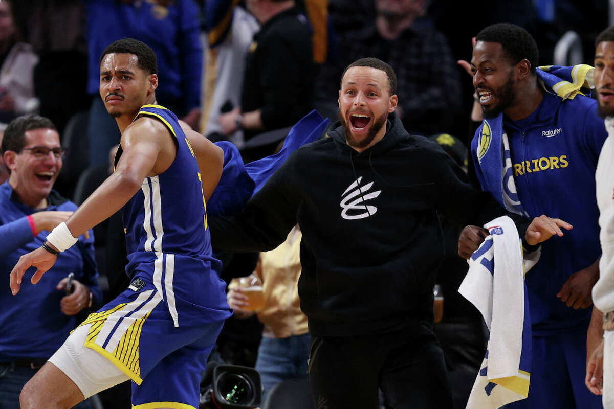 An ebullient Steph Curry celebrates after Jonathan Kuminga dunked the ball against the Trail Blazers at Chase Center on Feb. 28, 2023, in San Francisco.