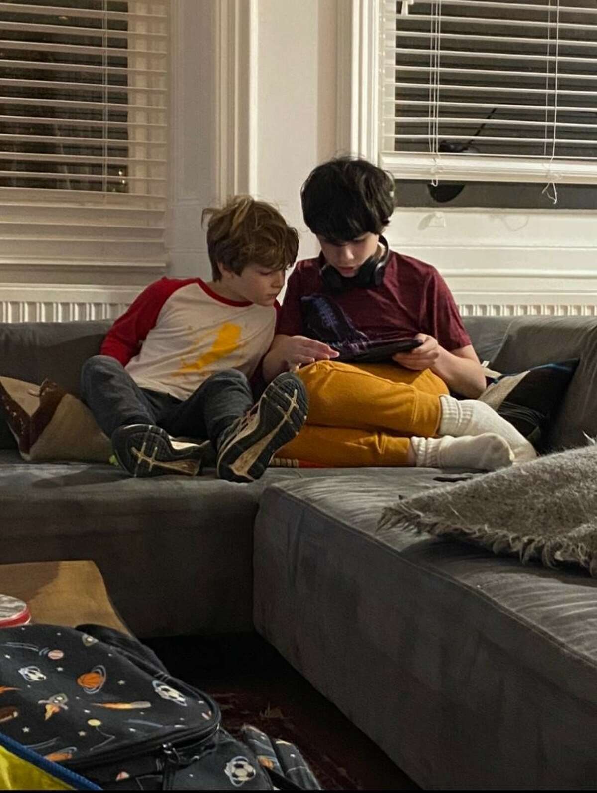 Claire Tisne Haft's sons, Louie and George, addicted to their devices.