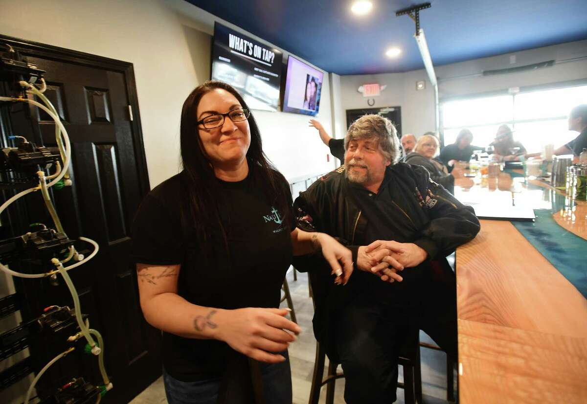 Co-owner Crystal Ardito-Meyers and customer Geoff Viscount, of Milford, at the new Nautilus tavern/ restaurant at 54 Naugatuck Avenue in the Walnut Beach section of Milford, Conn. on Wednesday, March 01, 2023.