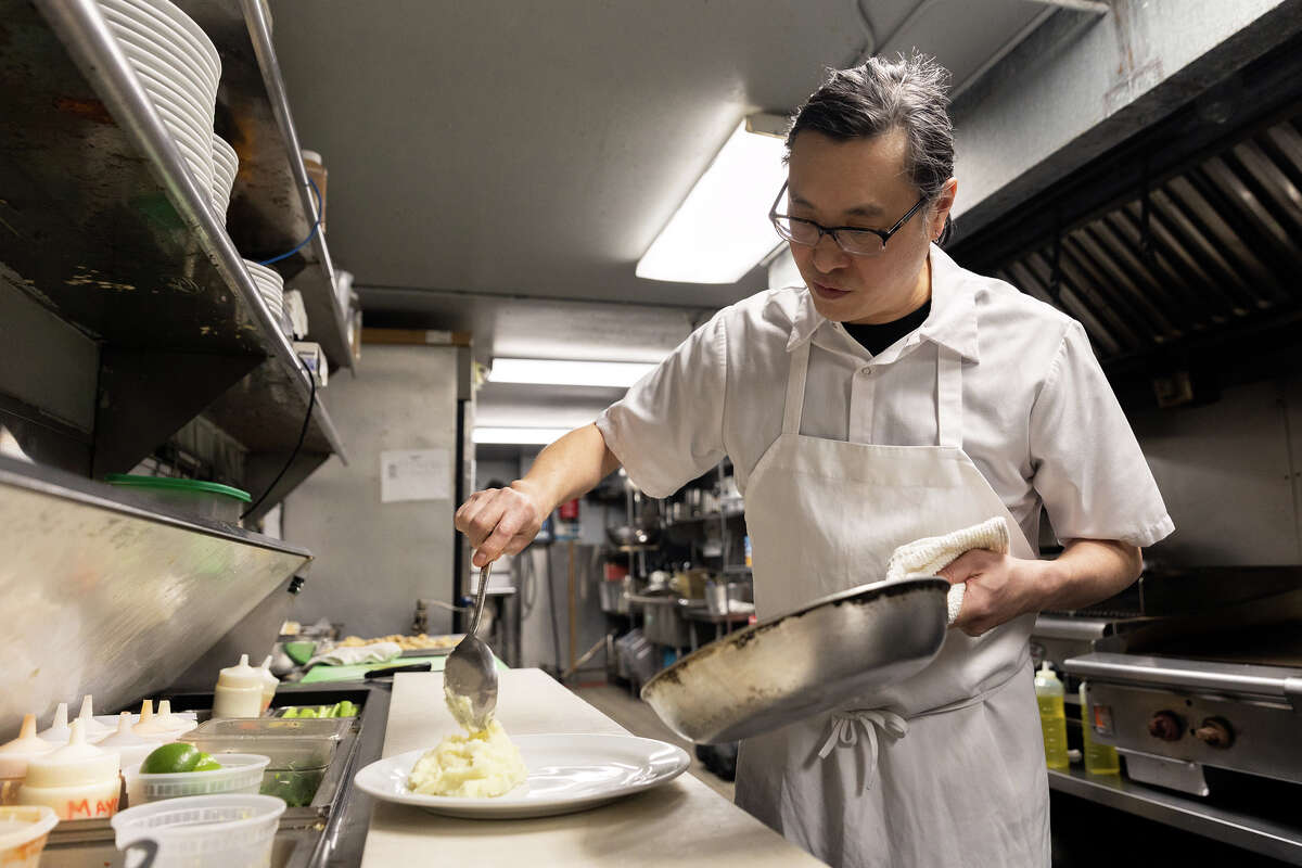 Chef Chris Hui serves mashed potatoes at the Gold Club on February 28, 2023 in San Francisco. 