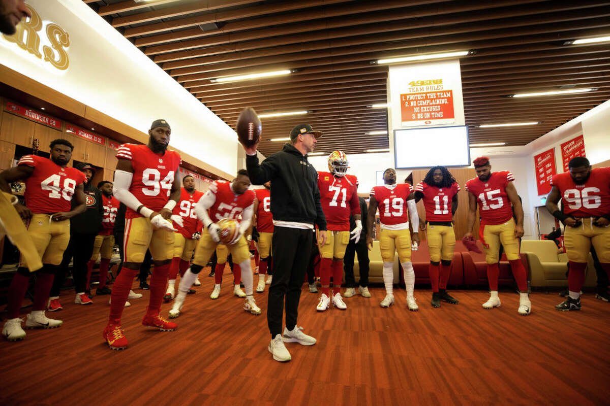 Head coach Kyle Shanahan of the San Francisco 49ers addresses the team in the locker room before a playoff game against the Cowboys at Levi's Stadium on Jan. 22, 2023, in Santa Clara, Calif.