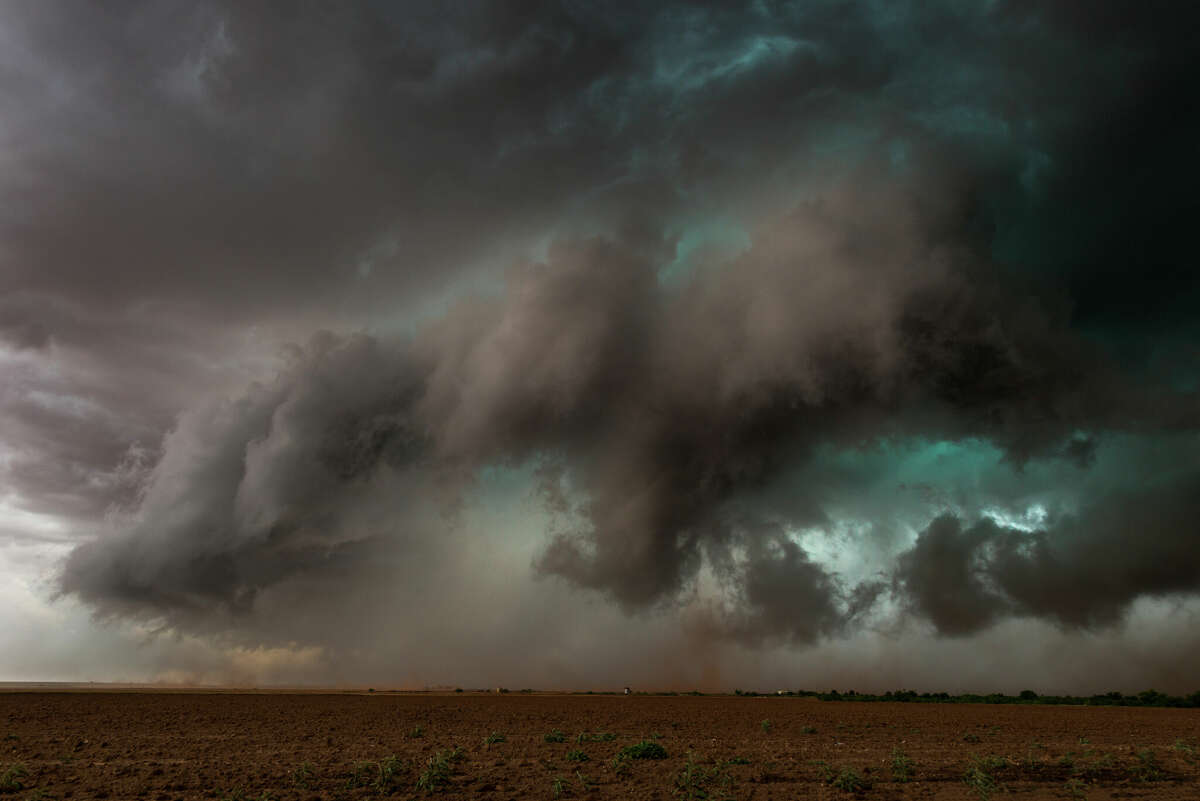 Extreme weather, a multi vortex tornado touches down in the same field as the photographer. Very dramatic weather photograph taken near Patricia in TX, USA.