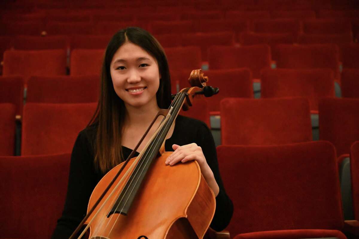 Eujeong Choi, a 16-year-old cellist from Niskayuna, sits for a photo at Proctors Theatre, where she is preparing to make her professional debut as a featured soloist with Schenectady Symphony Orchestra on Wednesday, March 1, 2023, in Schenectady, N.Y.