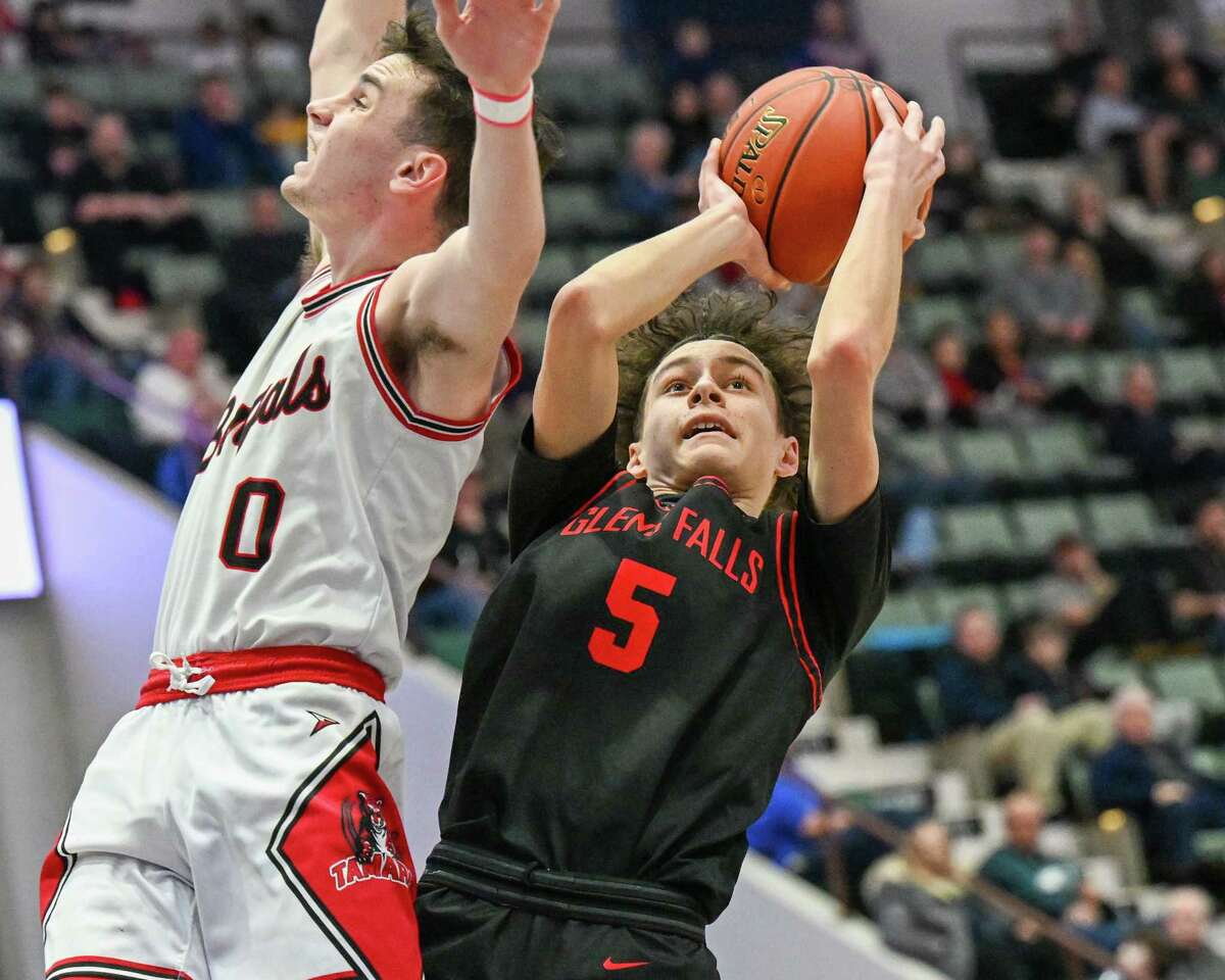 Glens Falls sophomore Oscar Lilac takes a jumper in front of Tamarac senior Mikey D’Agostino during the Class B semifinals on Wednesday, March 1, 2023, at the Cool Insuring Arena in Glens Falls, NY.