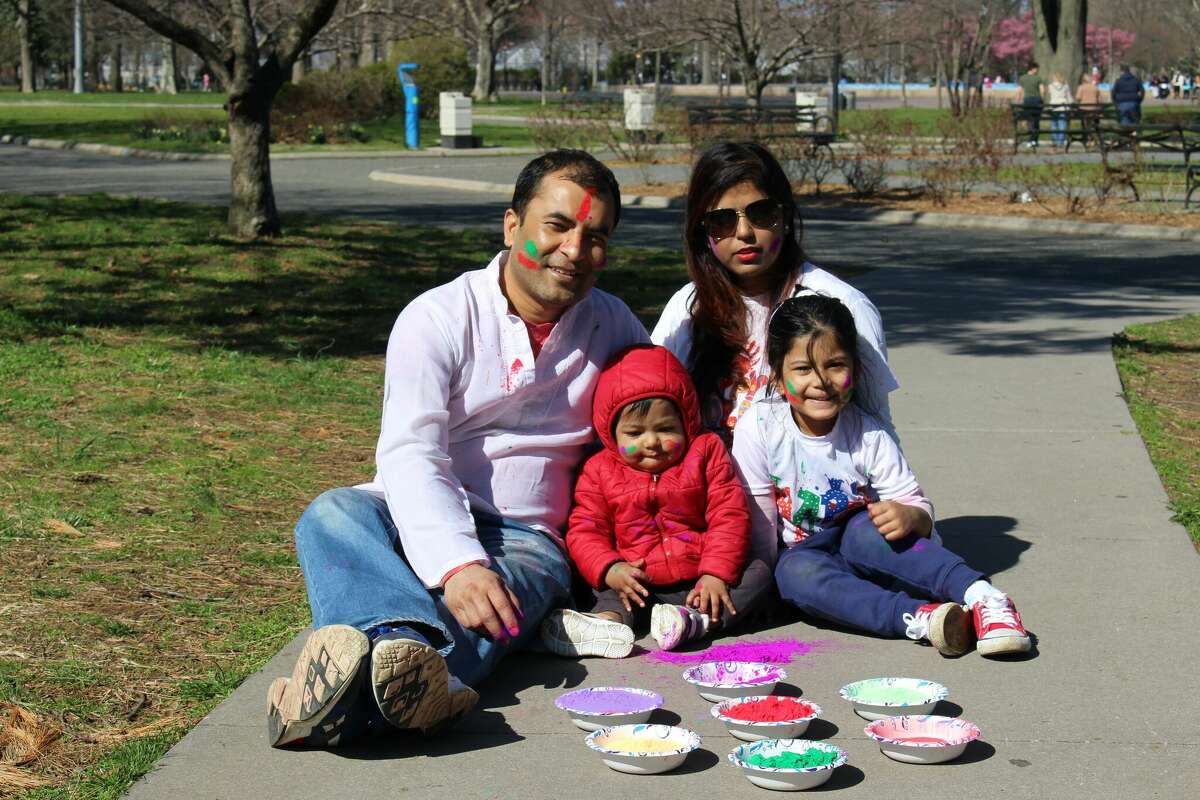 Holi, an ancient Hindu tradition signifies the triumph of good over evil, and will be celebrated March 11 and 12 locally with color tossing and reaching out to others. Here, local residents participate in the tradition.  