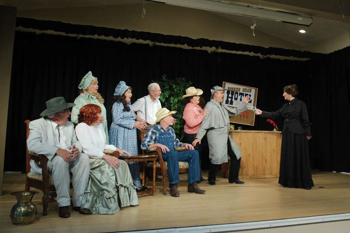 Pete Sparaco, left, Barb Hamilton, Carol Willis, Sue Martinez, Ben Smusz, Tim Stansbury, Lisa Stansbury, Paul Hamilton and Donna McBride rehearse a scene from "Blazing Guns at Roaring Gulch," at the Carriage Hose social hall at Country Place in Pearland.
