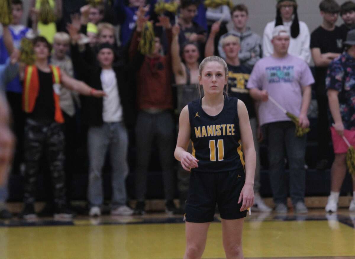 Manistee senior point guard Lacey Zimmerman watches on as her teammate shoots a free throw. 