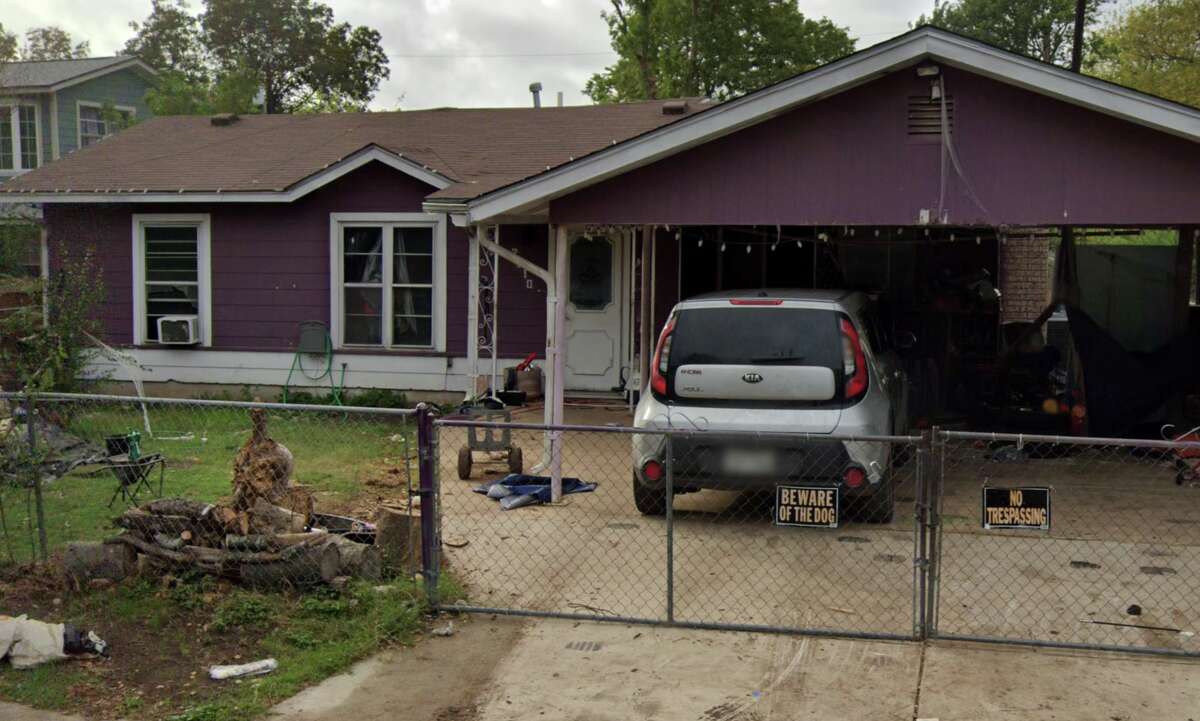 The dogs were kept inside the yard behind a chain link fence at Christian Moreno's home seen here. 