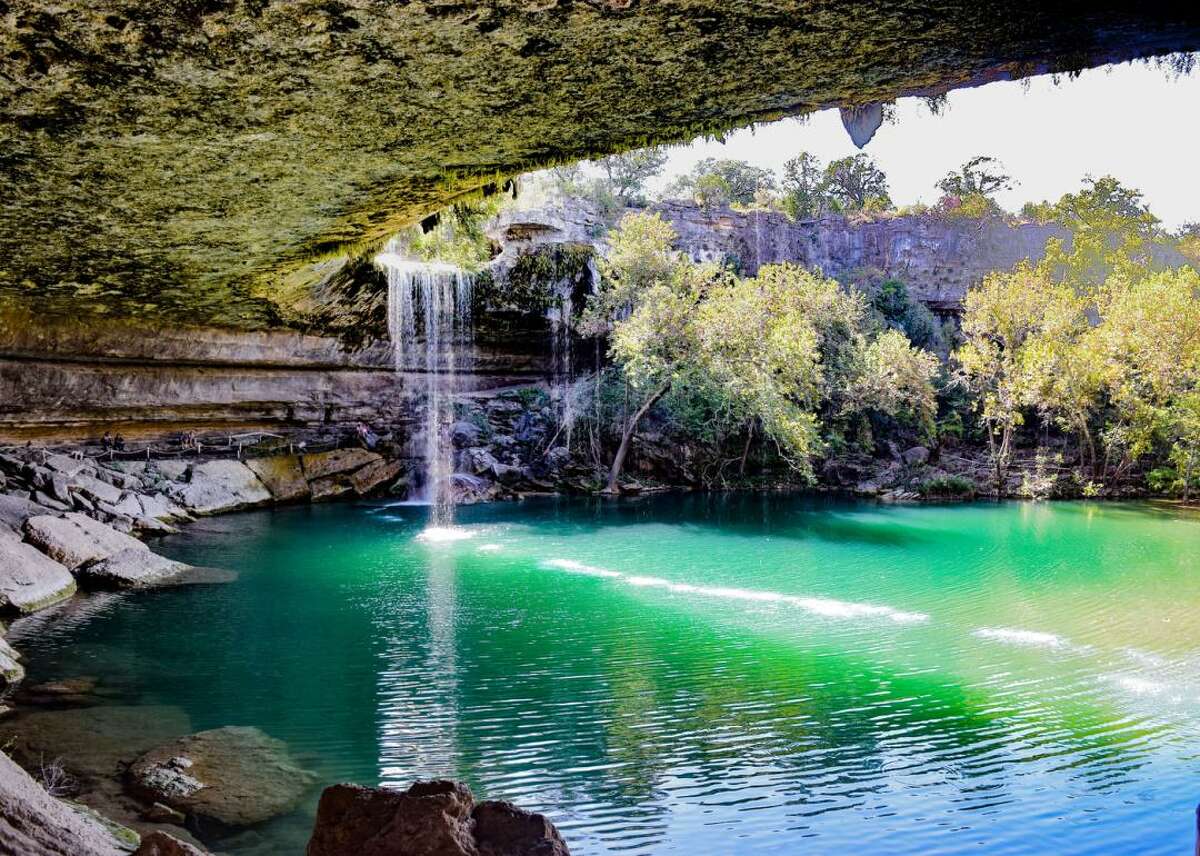 Take a dip at Hamilton Pool Preserve in Travis County, Texas Located just 23 miles west of Austin, the stunning natural Hamilton Pool Preserve was first created when an underground river collapsed thousands of years ago. While it's still off the beaten path, it's slowly becoming a more popular tourist destination. Visitors can enjoy swimming in the jade green water and taking in the pool's 50-foot waterfall.
