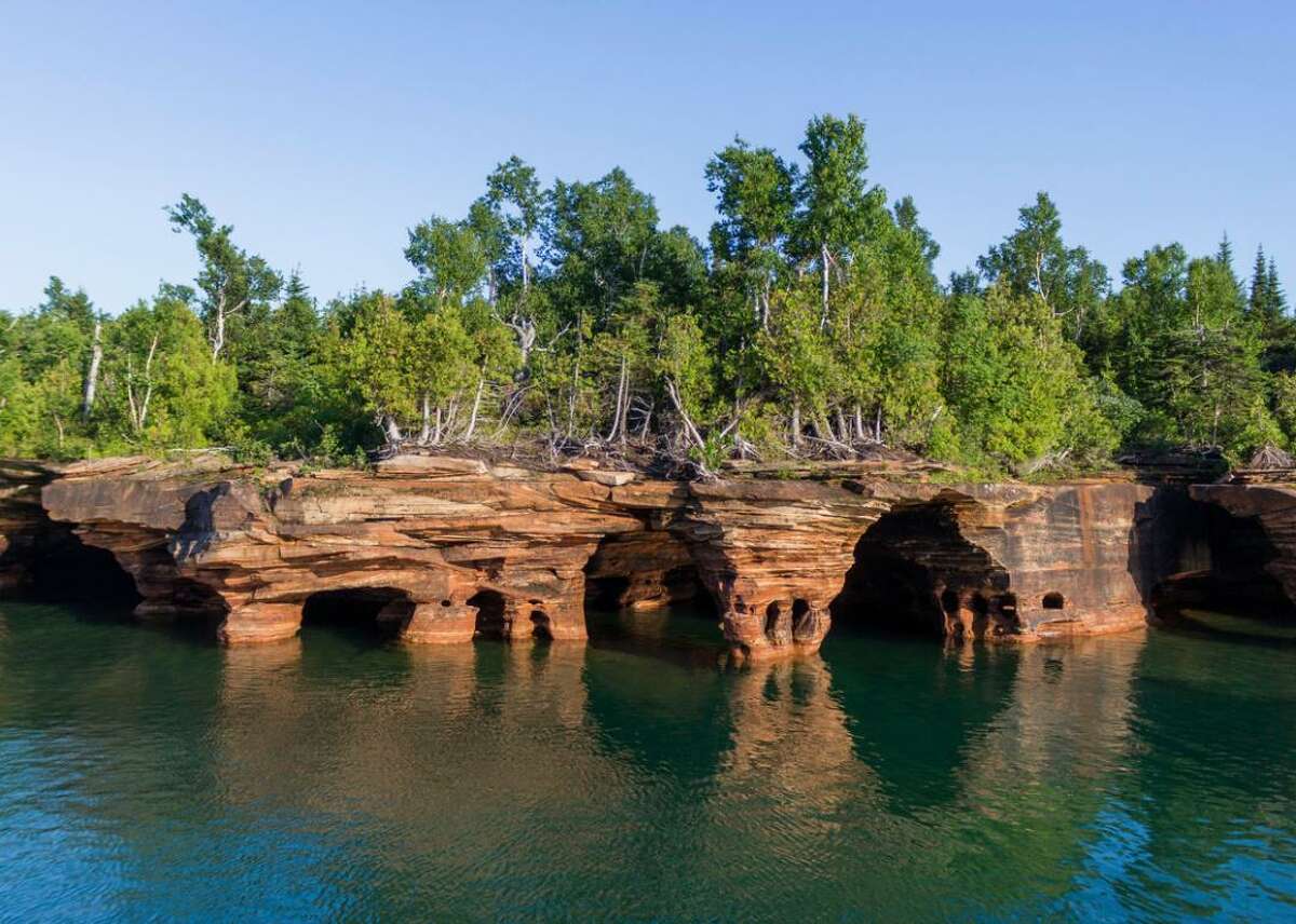 Escape to Apostle Islands in Lake Superior, Wisconsin Wisconsin's Lake Superior is home to a whopping 22 islands collectively known as the Apostle Islands, which offer a secluded escape to visitors. A major highlight is the islands' gorgeous natural ice caves, which you can explore via kayak in the spring and summer.