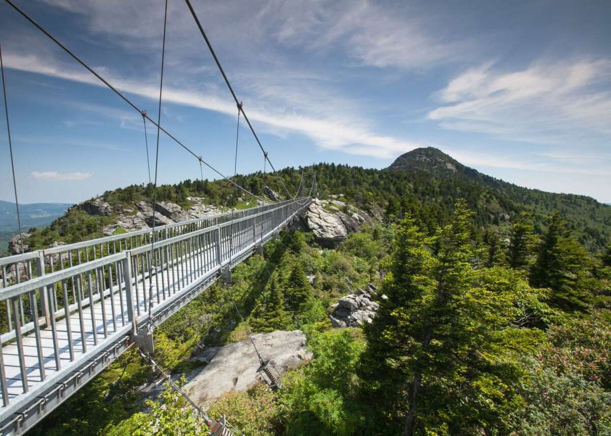 Mile High Swinging Bridge in Linville, North Carolina Brave the heights of Grandfather Mountain's Mile High Swinging Bridge, a 228-foot suspension bridge that spans an 80-foot chasm and provides breathtaking 360-degree views of the surrounding North Carolina mountains. While you're in town, you can also enjoy nearby hiking trails and wildlife habitats at the Wilson Center for Nature Discovery.