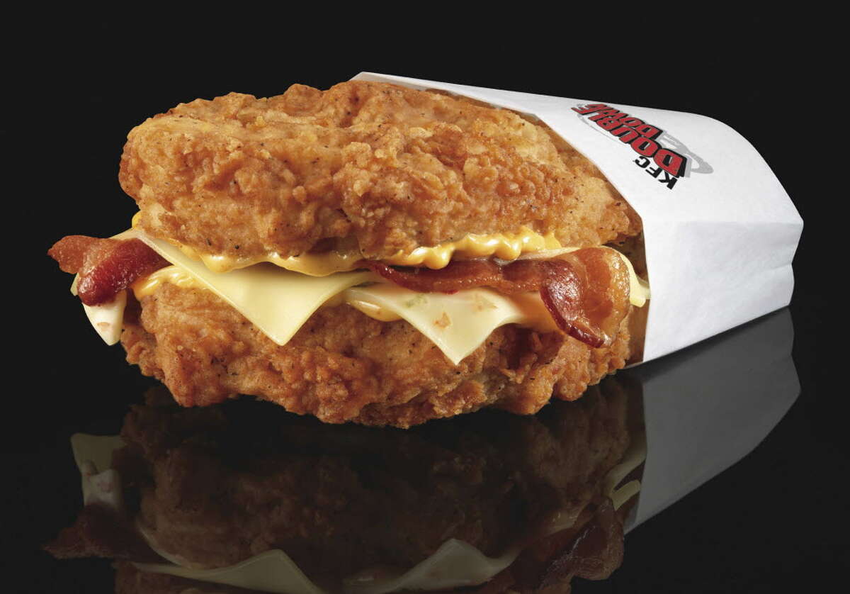 The Double Down is a sandwich with two chicken filets taking the place of bread slices. In between are two pieces of bacon, melted slices of Monterey Jack and Pepper Jack cheese and a zesty sauce.