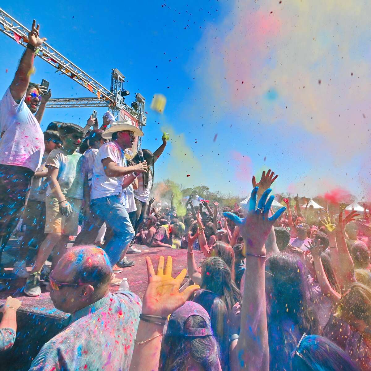Vibrant colors are thrown as part of Holi festivities. 