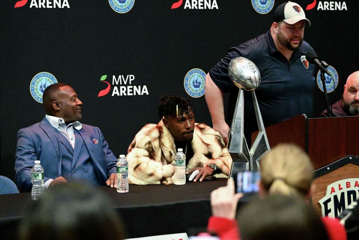 Former Albany Firebirds player Eddie Brown, left, and son Famed NFL wide receiver Antonio Brown, center, are welcomed to the Albany Empire National Arena League team's ownership group by Mike Levack, director of media relation for Albany Empire, right, on Thursday, March 2, 2023, during a press conference at MVP Arena in Albany, N.Y. 