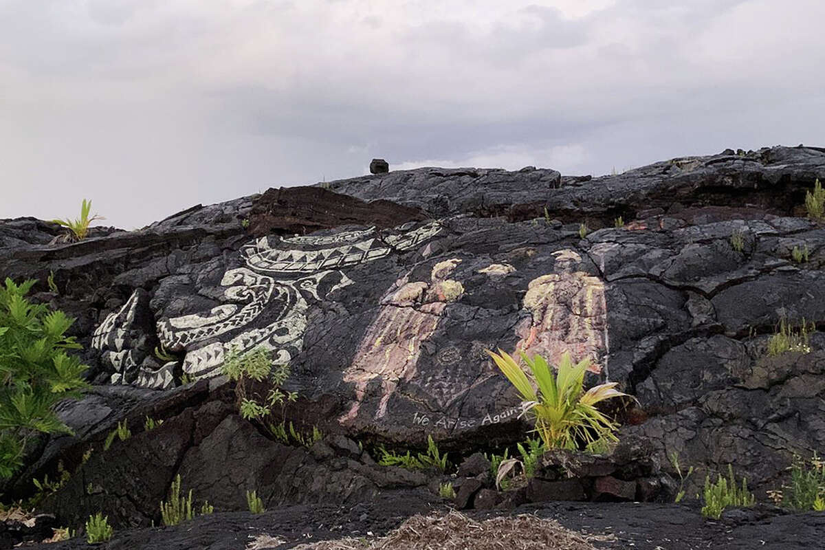 Art can be seen around Uncle Robert's Awa Bar, including the Hawaiian Kingdom's coat of arms on the right.