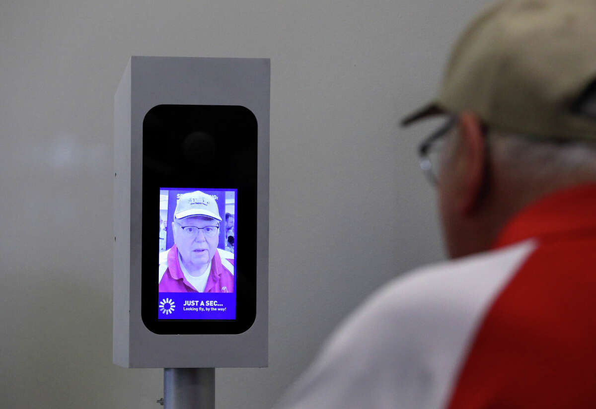 A passenger boarding flight 773 to Aruba uses JetBlue's facial-recognition system at Boston Logan International Airport on Jun. 15, 2017.