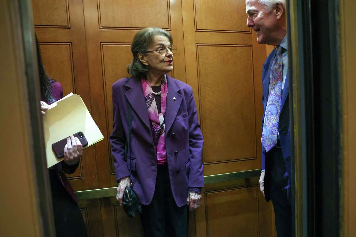 U.S. Sen. Dianne Feinstein, D-Calif., boards an elevator with Sen. John Cornyn, R-Texas, at the U.S. Capitol on Feb. 16. Feinstein has missed a dozen votes and two committee hearings since being diagnosed with shingles in late February.