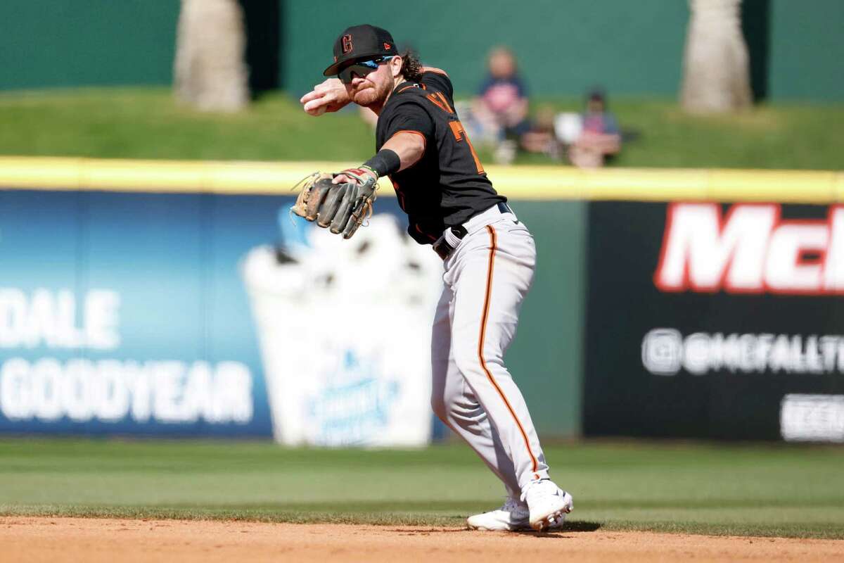 Giants second baseman Brett Wisely throws to first during the fifth inning of a spring training game against Cleveland in Goodyear, Ariz., on Tuesday.