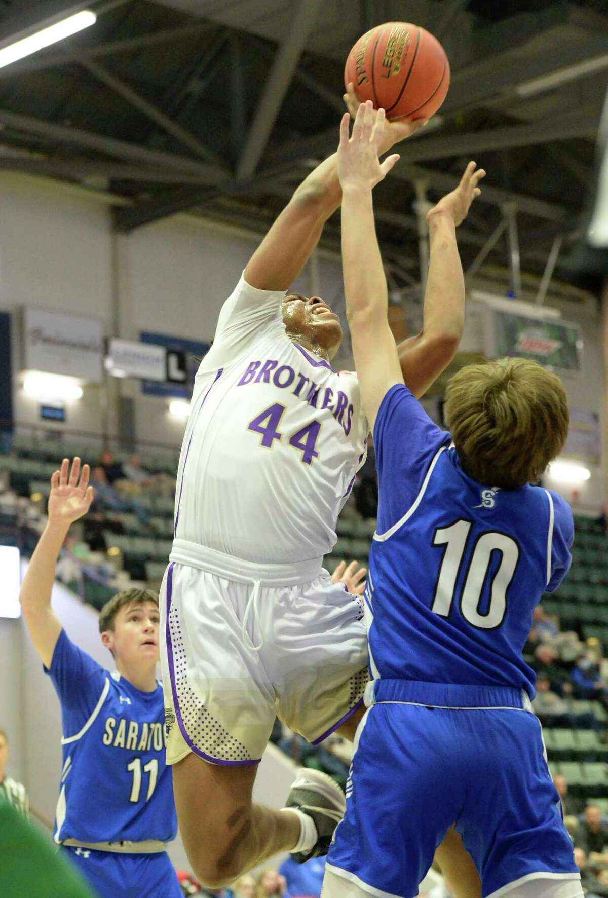 Saratoga Springs’ Andrew Masten attempts to block a shot by CBA’s Aiden Wine during their Class AA semifinal at Cool Insuring Arena in Glens Falls, N.Y. on Thursday, Mar. 2, 2023. (Jenn March, Special to the Times Union)