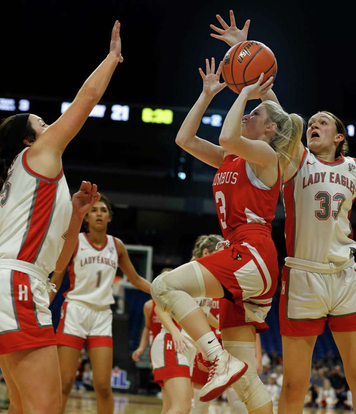 Holliday Katy Jo Piper (33) blocks shot attempt from Columbus Bailey Gustus (3) in UIL Class 3A state semifinal game where Holliday defeated Columbus 59-40 on Thursday, March 2, 2023 at the Alamodome.