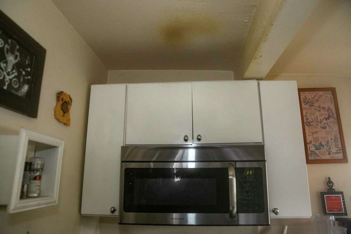 Residue from the stove’s exhaust fan has stained the ceiling in Linda’s kitchen.