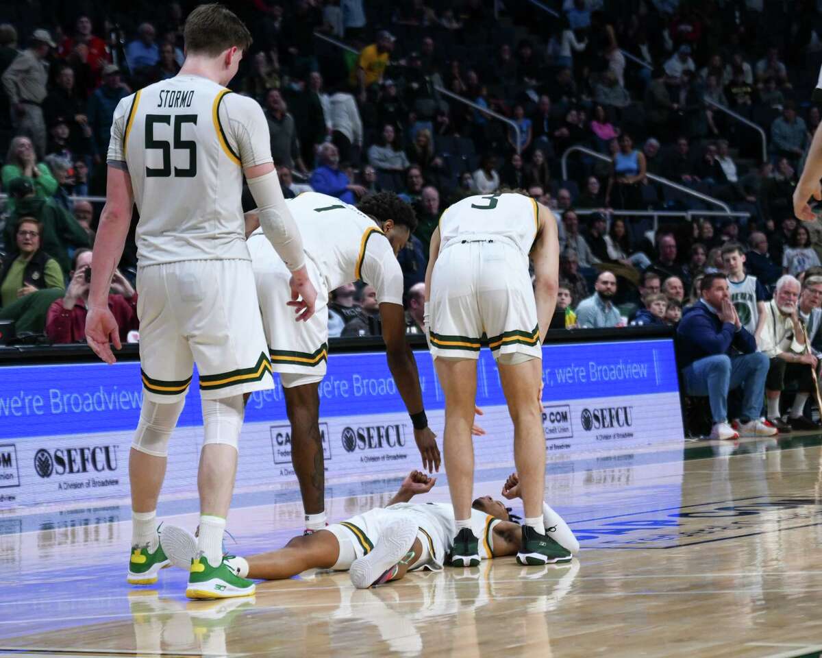 Siena players surround sophomore Javian McCollum after he lost the ball and then missed a shot in the final seconds of a game against Manhattan on Thursday, March 2, 2023, at the MVP Arena in Albany, NY.