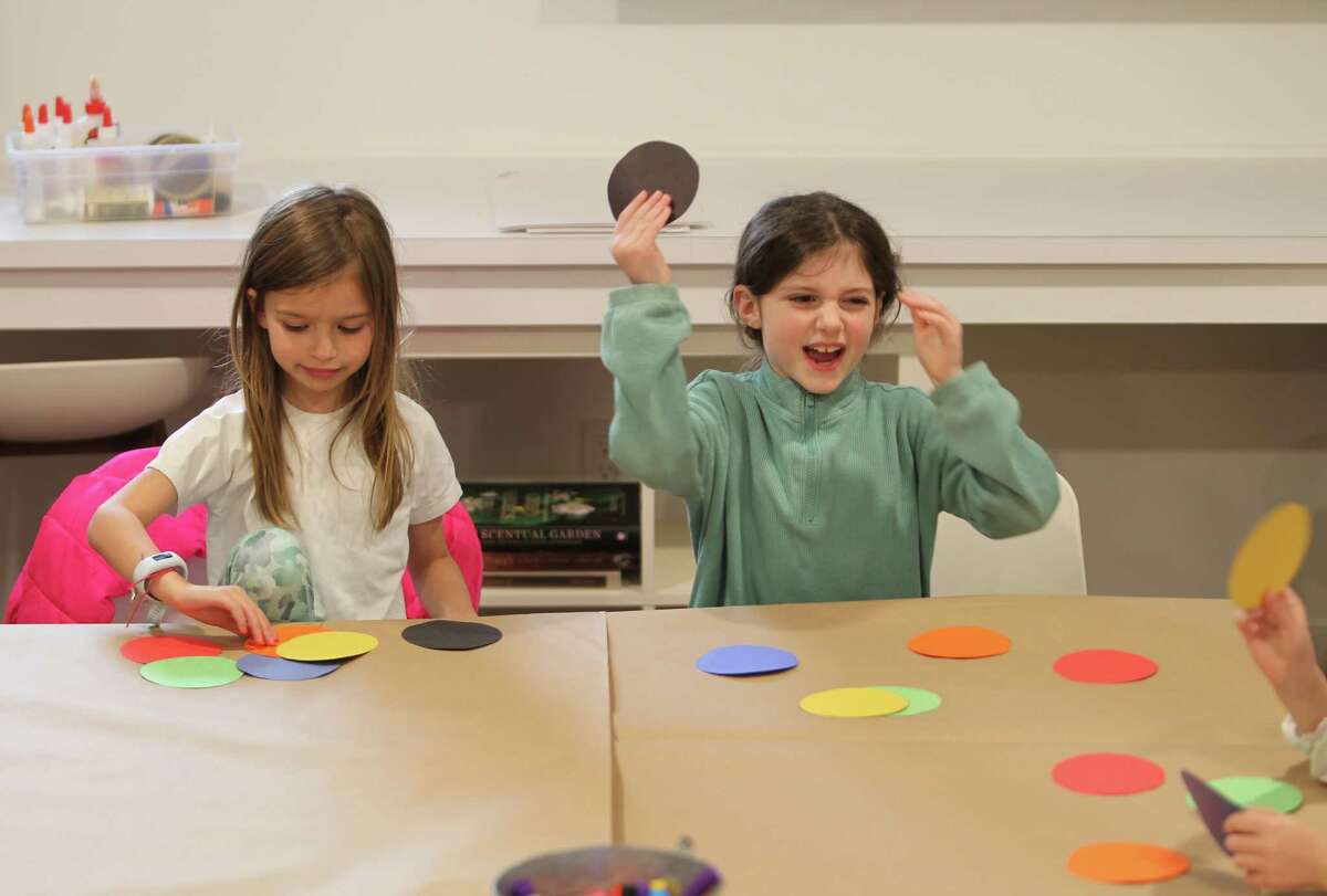 Clara Collingham (left) and Ellory Sayre attend a popular after-school art class taught by Tiffany McKay at the Carriage Barn Arts Center in New Canaan, Conn., on Thursday, March 2, 2023.  In this class, children learn about the artist Wassily Kandinsky and how he uses music as an inspiration for their work.  Each week, children learn about a leading artist, practice their techniques and create a piece inspired by their style.  For information on programs at the arts center, visit: www.carriagebarn.org