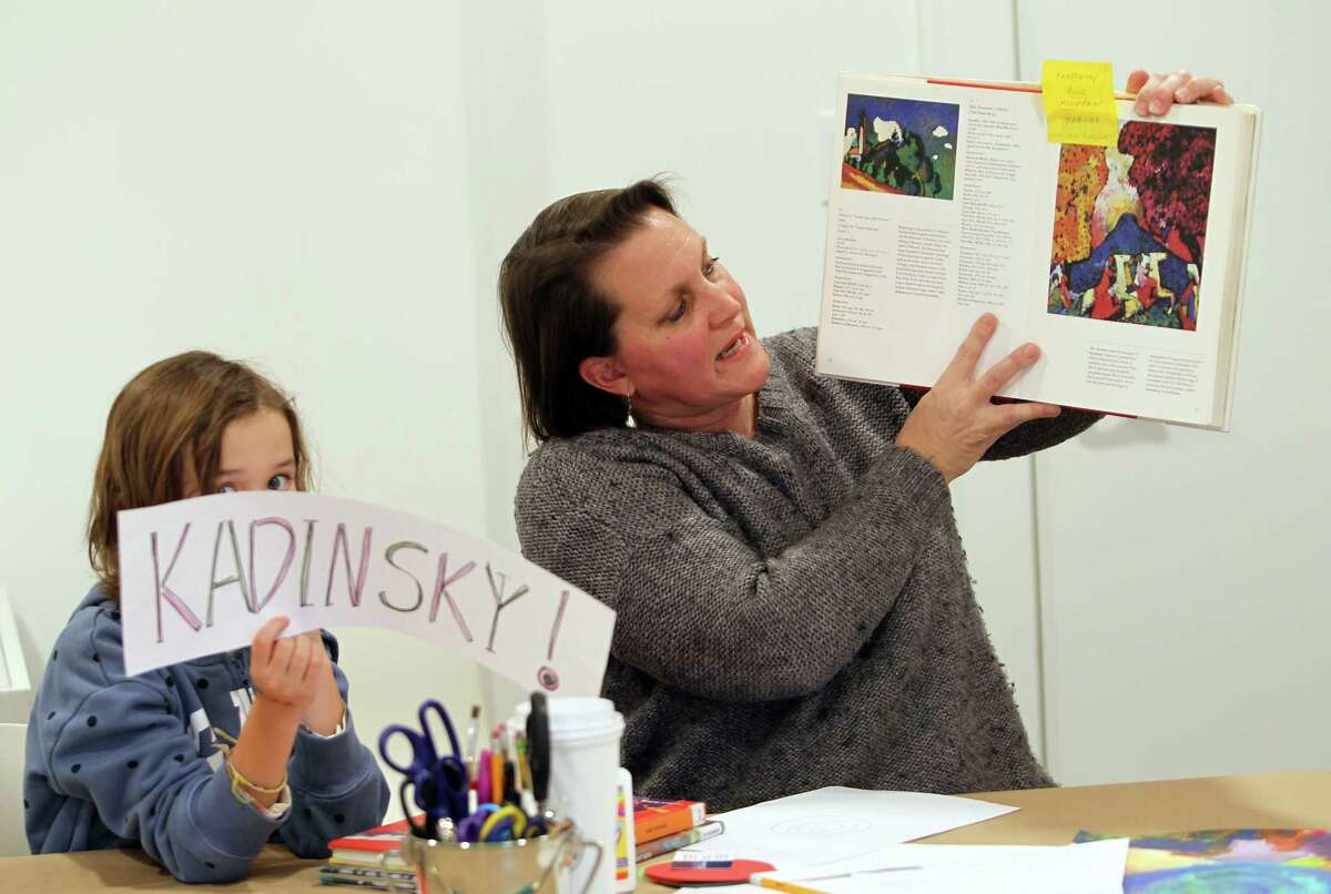 Tiffany McKay teaches about artist Wassily Kandinsky at an after-school art class for children at the Carriage Barn Arts Center in New Canaan, Conn., on Thursday, March 2, 2023.  Each week of the four-week course, children learn about a leading artist.  , apply their techniques and create a piece inspired by their style.  For information on programs at the arts center, visit: www.carriagebarn.org