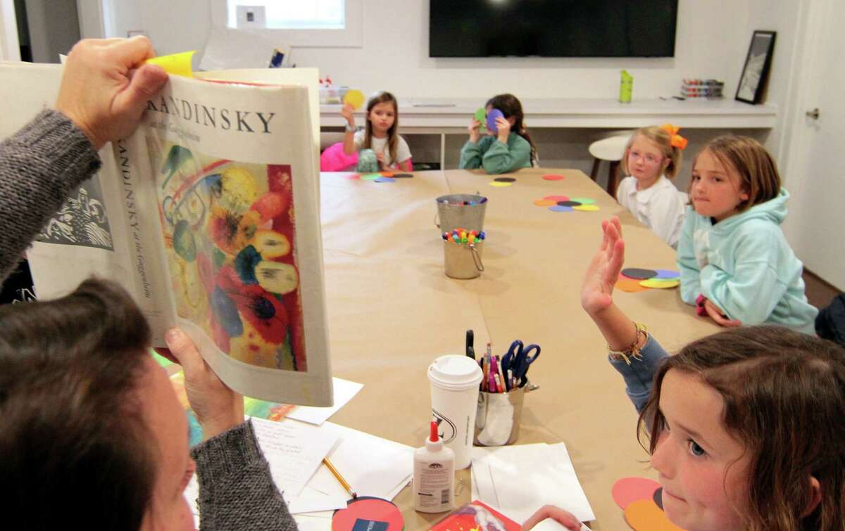 Tiffany McKay teaches about artist Wassily Kandinsky at an after-school art class for children at the Carriage Barn Arts Center in New Canaan, Conn., on Thursday, March 2, 2023.  Each week of the four-week course, children learn about a leading artist.  , apply their techniques and create a piece inspired by their style.  For information on programs at the arts center, visit: www.carriagebarn.org