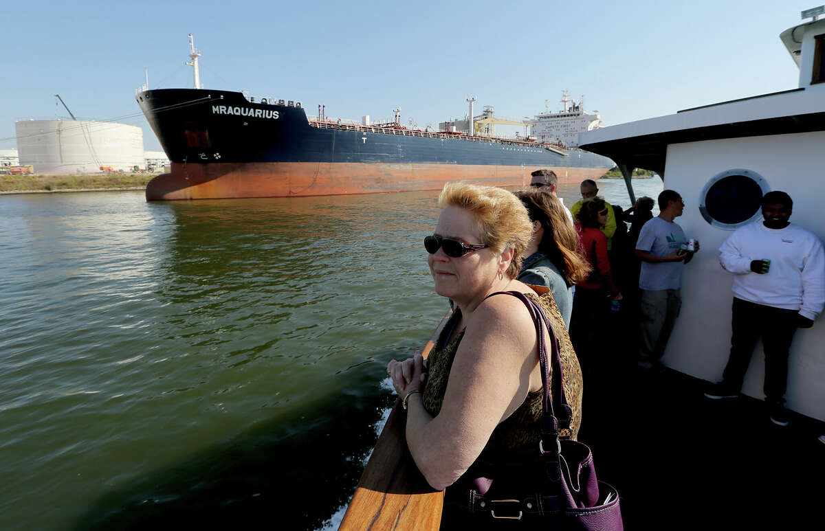 Debbie Toaltoan , from Parkesburgh, PA looks at the Houston Ship Channel  as she travels on the Sam Houston boat tour. 