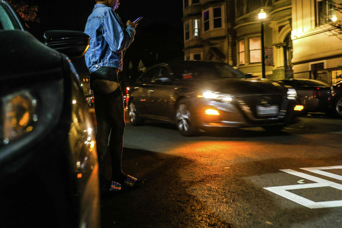 Nyomie, a sex worker, waits on Capp Street for a client in San Francisco. SB357 repeals previous California law that criminalized loitering with the intent to engage in sex work. 