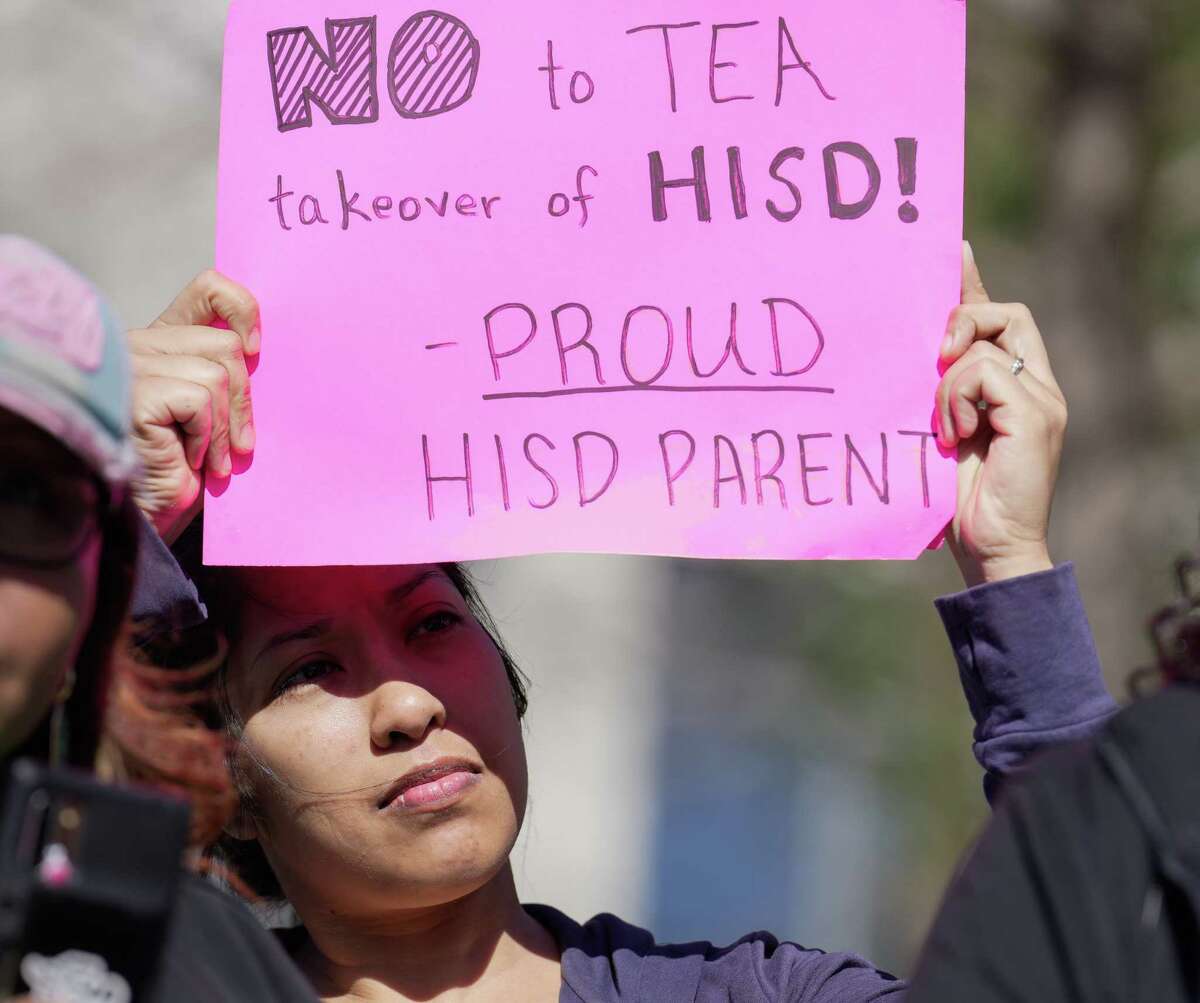 Houston ISD parent Audrey Nath protests against the TEA takeover of the district outside the HISD administration building on Friday, March 3, 2023.