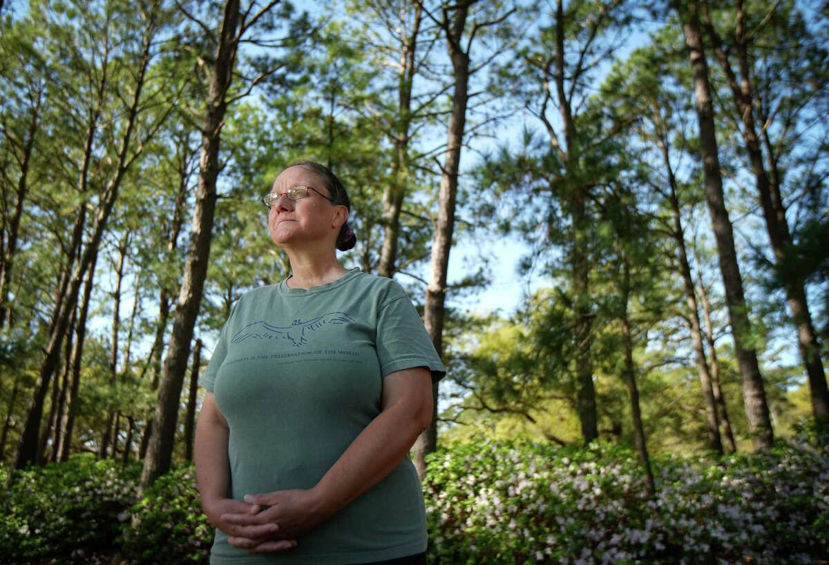 Lisa Brenskelle poses for a portrait Friday, March 3, 2023, at Hermann Park in Houston. She plans to lead a prayer walk in the park. “I think it will be a nice experience of spirituality in nature,” she said.