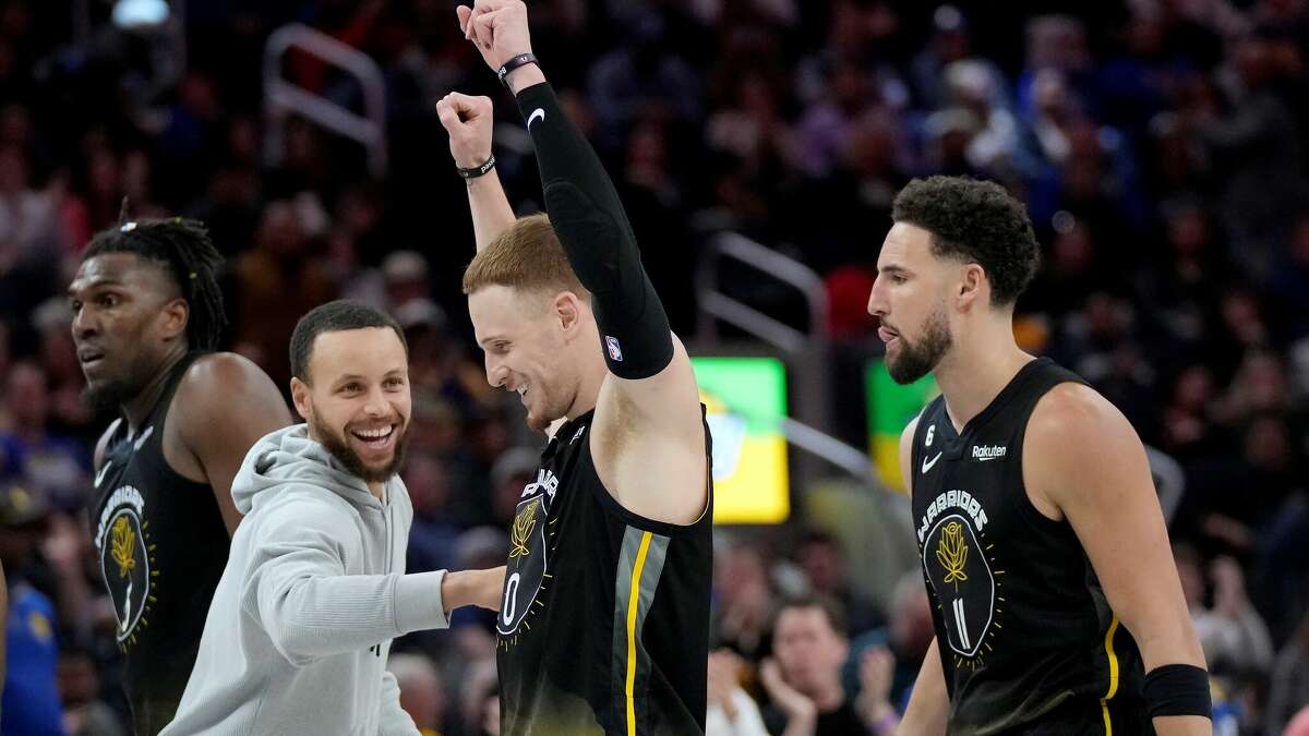 Left to right, Kevon Looney, Stephen Curry, Donte DiVincenzo and Klay Thompson revel in Thursday night's beatdown of the Clippers in San Francisco.