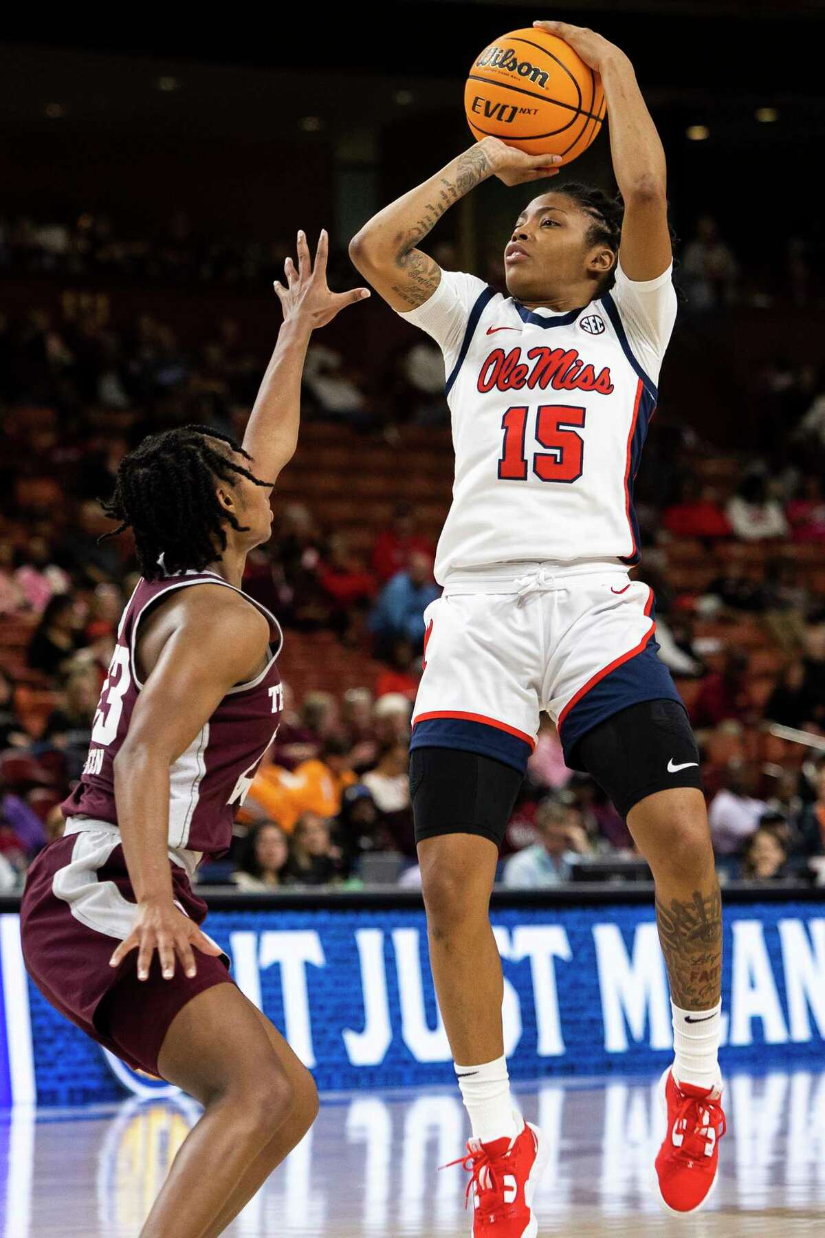Mississippi's Angel Baker (15) goes up for a shot against Texas A&M's McKinzie Green (23) in the first half of an NCAA college basketball game during the Southeastern Conference women's tournament in Greenville, S.C., Friday, March 3, 2023. (AP Photo/Mic Smith)