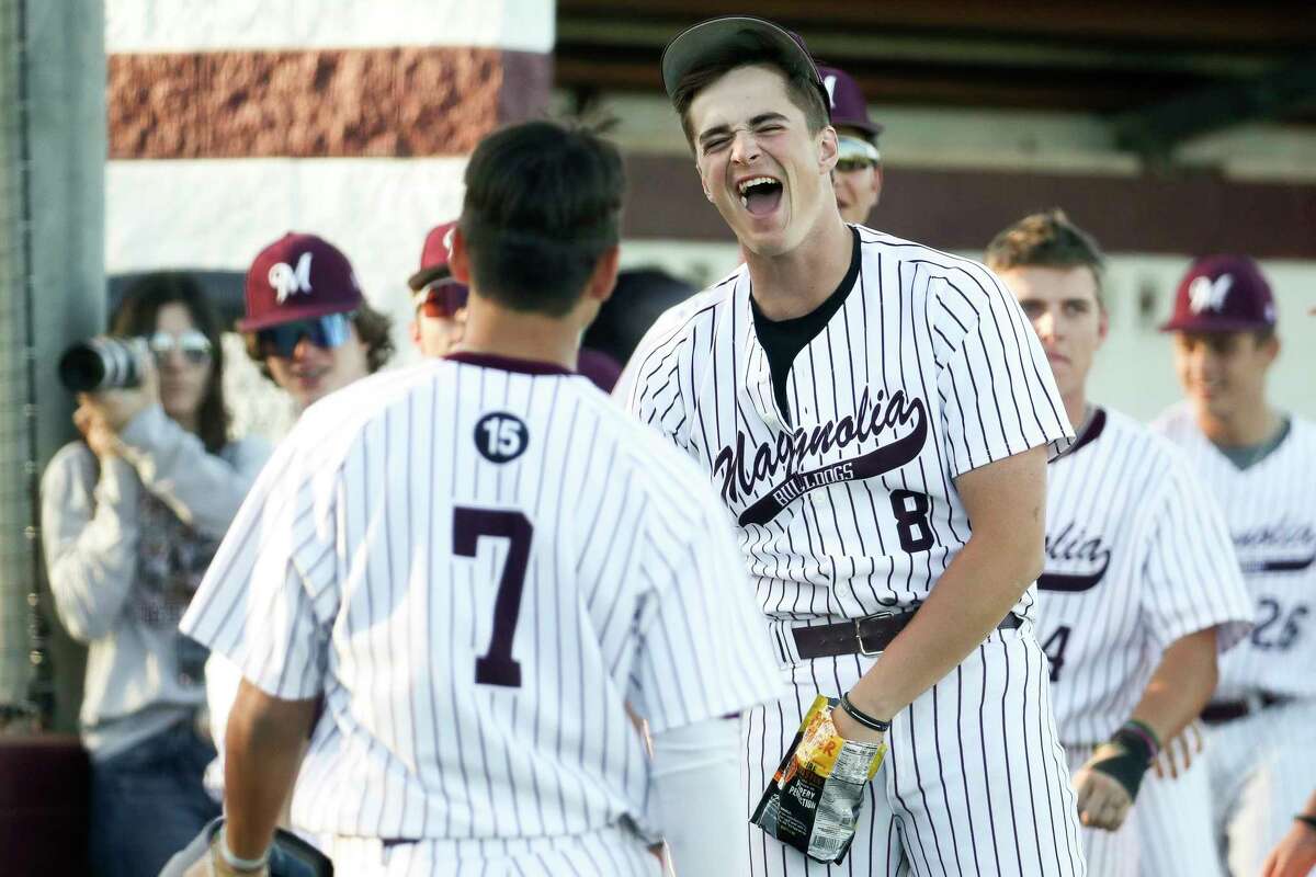 Magnolia’s Jon Shields, right, reacts toward Ryder Blair after he scored on TJ Peters’ bases-clearing 3-run double in the fifth inning of a non-district high school baseball game at Magnolia High School, Friday, March 3, 2023, in Magnolia.