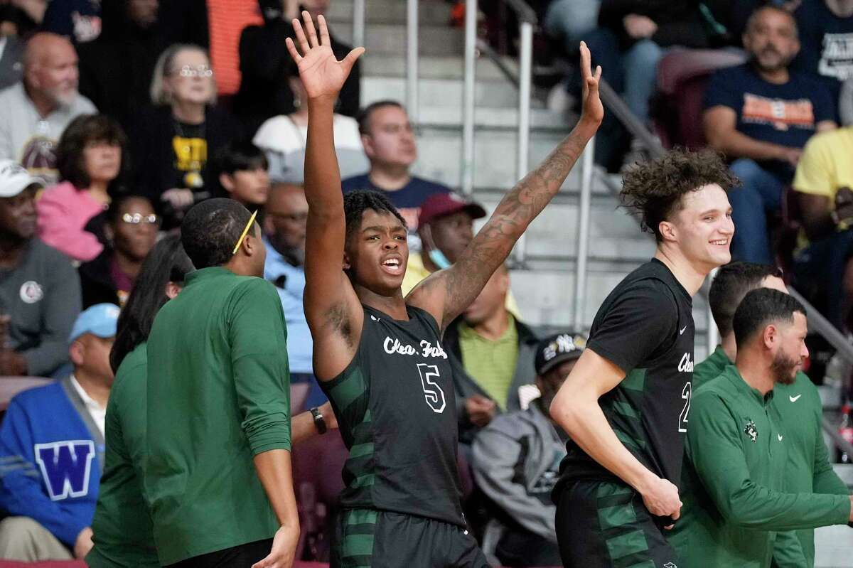 Clear Falls guard Josh Moore (5) celebrates the team's win over Seven Lakes in a Region III-6A semifinal high school basketball playoff game, Friday, March 3, 2023, in Houston.