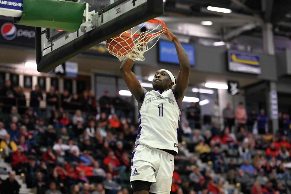 Catholic Central’s Darien Moore dunks the ball during the Class B Championship against Glens Falls at Cool Insuring Arena in Glens Falls, N.Y. on Saturday, Mar. 4, 2023. (Jenn March, Special to the Times Union)