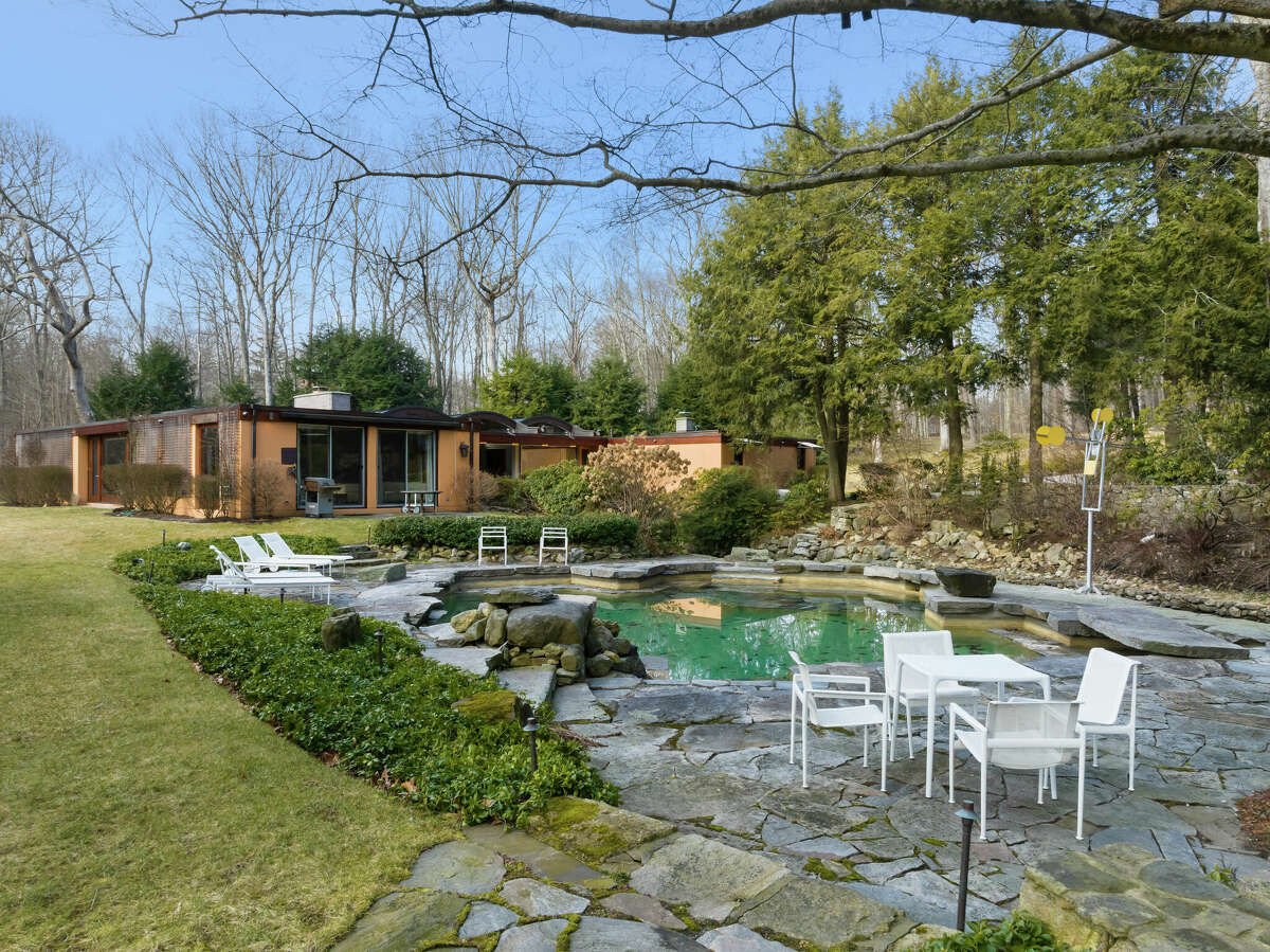 Designed by John Johansen of the Harvard Five with a bridge that spans the Rippowam River, a home at 93 Louises Lane in New Canaan is available to rent in August for $100,000.