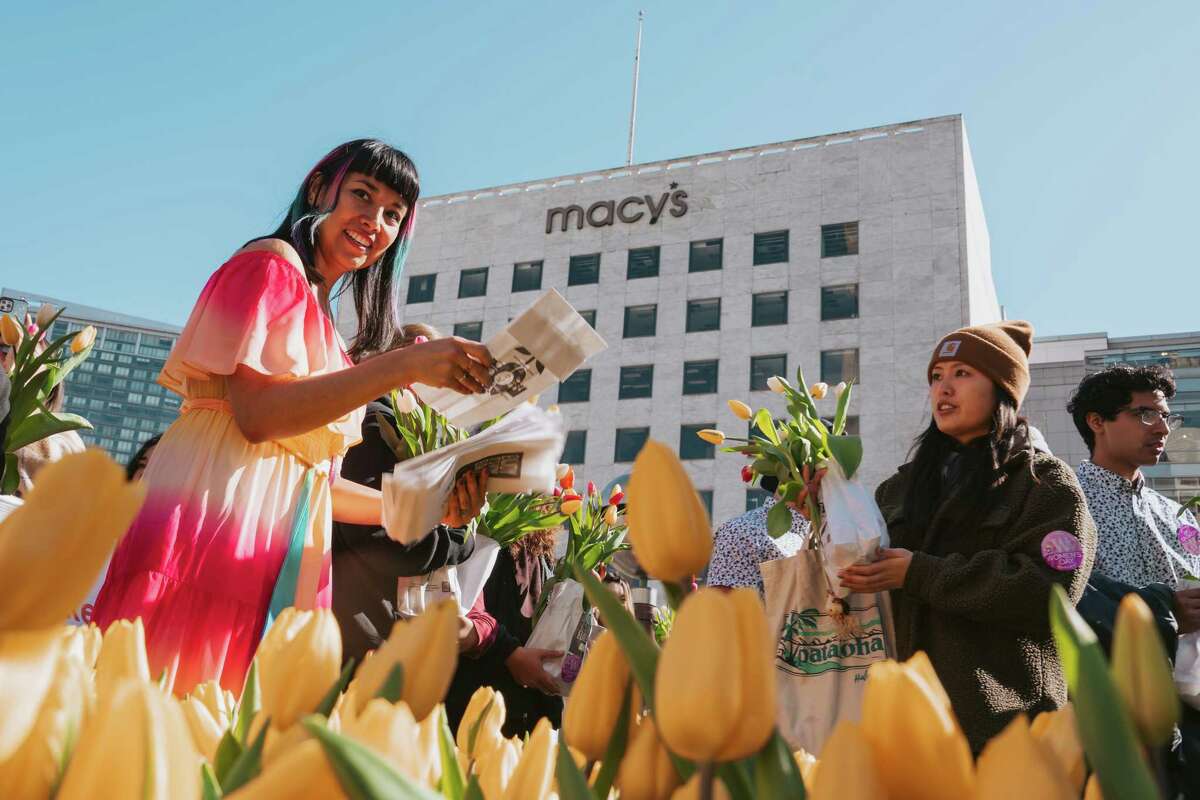 Event organizer Daniela Nunez Zurita of the Dutch Consulate distributes paper bulb bags at Bulb Day in San Francisco's Union Square on March 4. Berkeley-based promoter Another Planet Entertainment is proposing to host free outdoor concerts at various locations in the city over the next three years.