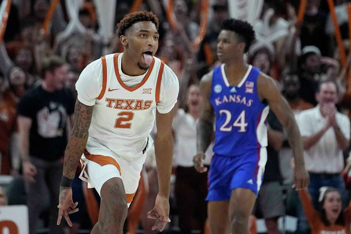 Texas guard Arterio Morris (2) celebrates a score against Kansas during the first half of an NCAA college basketball game in Austin, Texas, Saturday, March 4, 2023. Texas is one of seven men's teams representing the Lone Star State in this year's March Madness. 