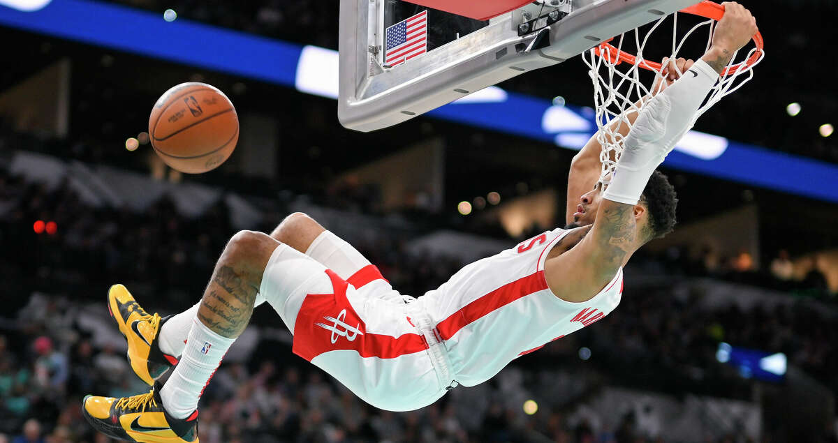 Houston Rockets' K.J. Martin dunks during the first half of an NBA basketball game against the San Antonio Spurs, Saturday, March 4, 2023, in San Antonio. (AP Photo/Darren Abate)