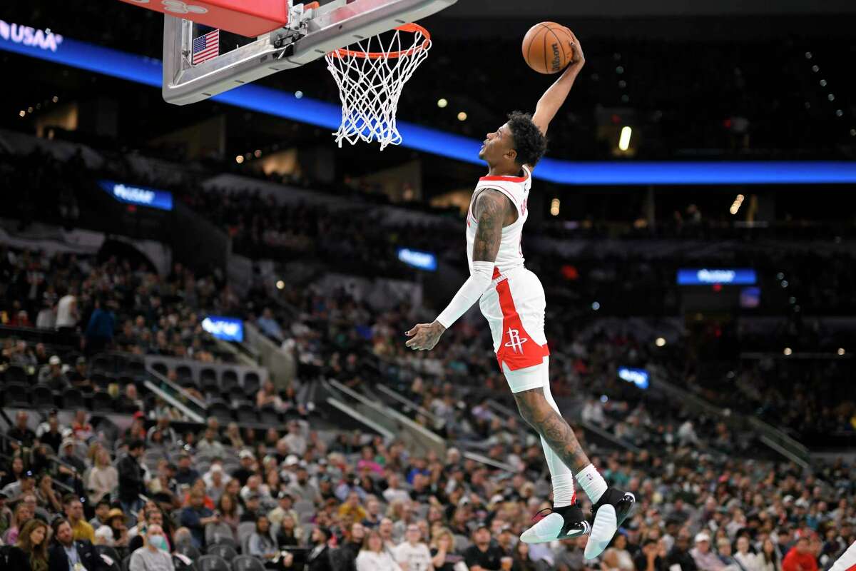 Houston Rockets' Jalen Green dunks during the first half of an NBA basketball game against the San Antonio Spurs, Saturday, March 4, 2023, in San Antonio.