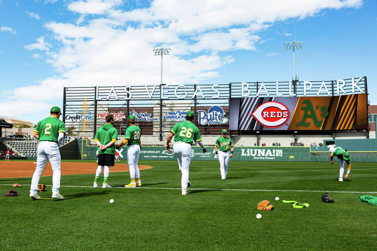 The Oakland Athletics warm up before a spring training game during Big League Weekend against the Cincinnati Reds at the Las Vegas Ballpark on Saturday, March 4, 2023, in Las Vegas.