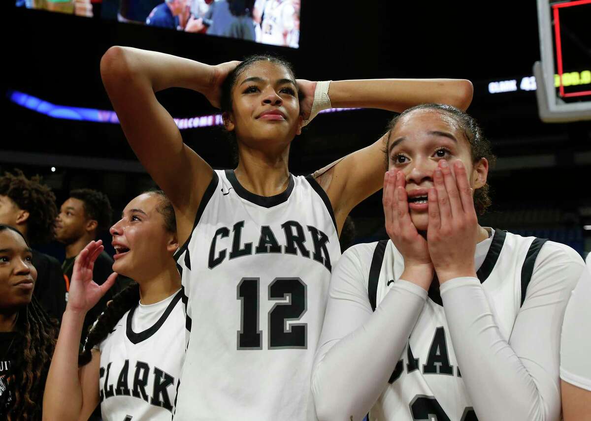 Clark Cougars’ Natalie Huff (1), Adrianna Roberson (12) and Kamryn Griffin (24) react after the end of the game. Clark defeated DeSoto 42-37 in girls basketball Class 6A state championship game on Saturday, March 3, 2023 at the Alamodome.