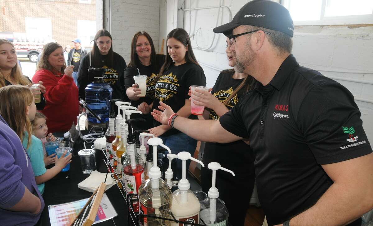 Customers are served some of Rachel & Co. Coffee House's signature drinks during a party marking new ownership of an old business on Saturday in downtown Wood River. Russell’s Corner Cafe at 1st and Ferguson streets is now Rachel & Co. Coffee House.