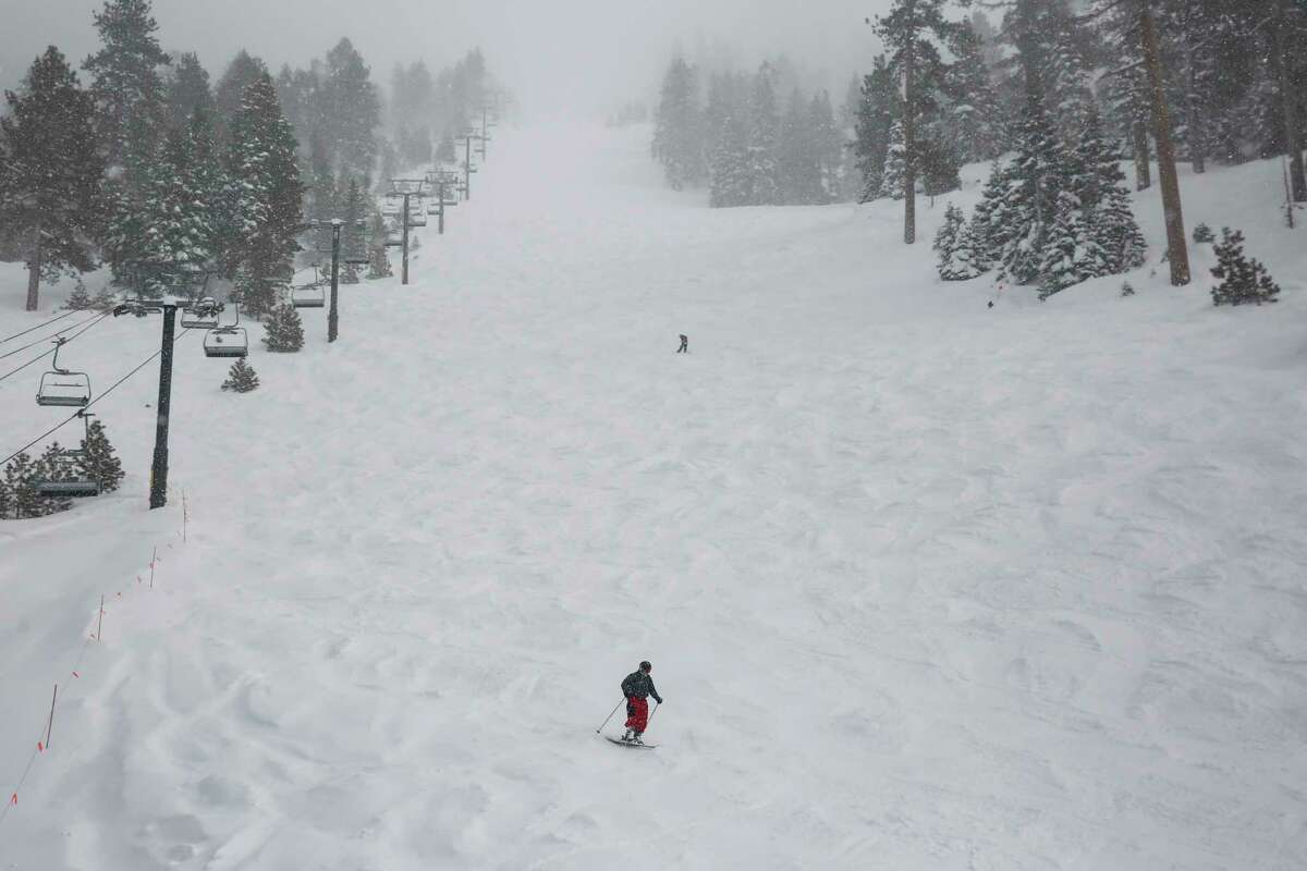Skiers and snowboarders come down the mountain on their last run after the lifts closed in the midafternoon at Heavenly Mountain Resort in South Lake Tahoe on Feb. 28. 